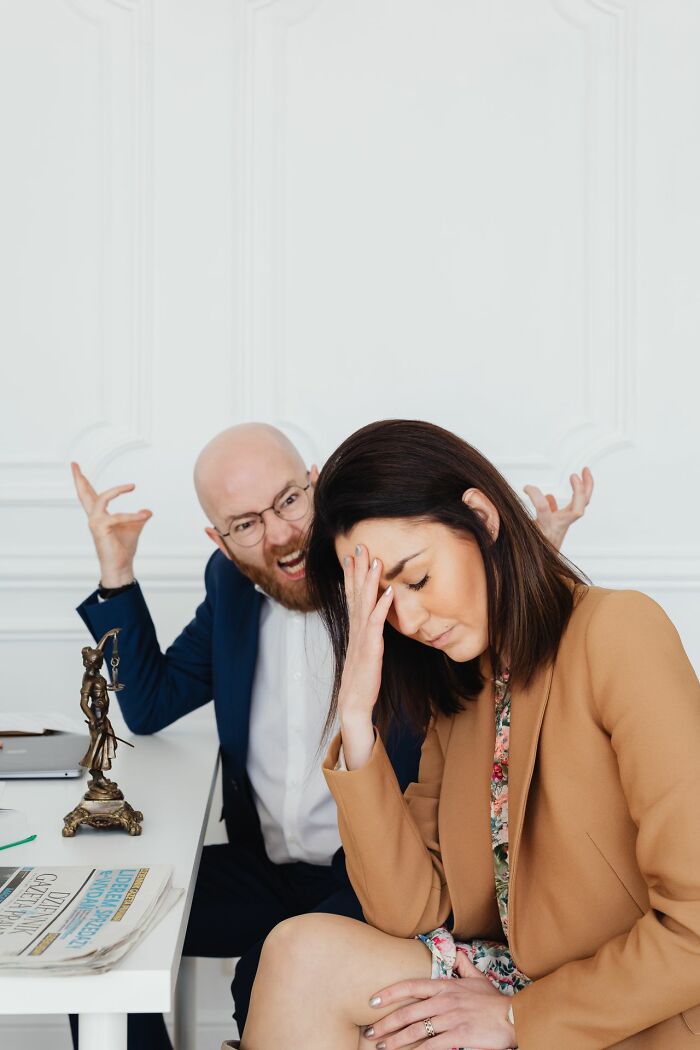 A man yelling at a distressed woman, symbolizing the end of a marriage.