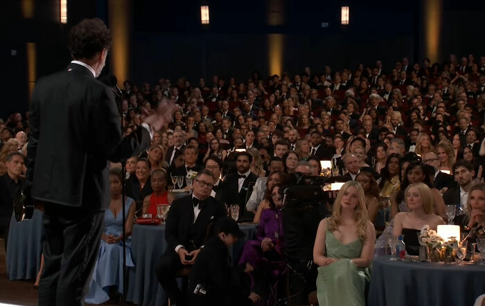 An audience at the Emmy presentation, silently staring after a joke from the stars. An audience at the Emmy presentation, silently staring after a joke from the stars.
