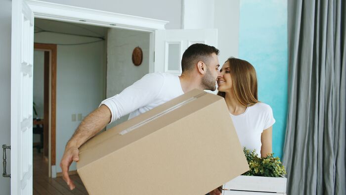 A couple moving, symbolizing a fresh start away from fake friends and haters.