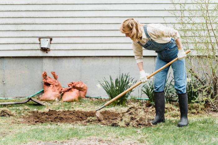 A woman uncovers secrets while gardening, turning over soil with a h*e in her backyard, revealing what was hidden.