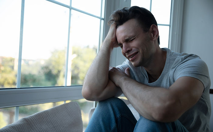 A man crying, visibly distressed, after his GF suddenly leaves while he's at work. A man crying, visibly distressed, after his GF suddenly leaves while he's at work.