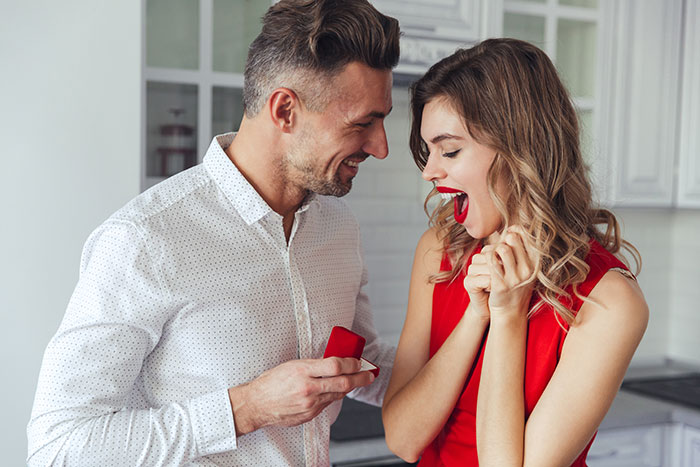 Man proposes to GF: a man holds an engagement ring, surprising his GF who suddenly leaves. Man proposes to GF: a man holds an engagement ring, surprising his GF who suddenly leaves.