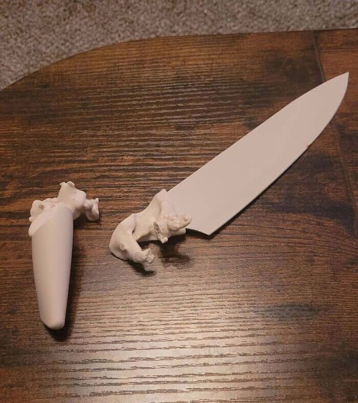 A broken ceramic chef knife with a decorative handle, highlighting unfortunate kitchen fails.