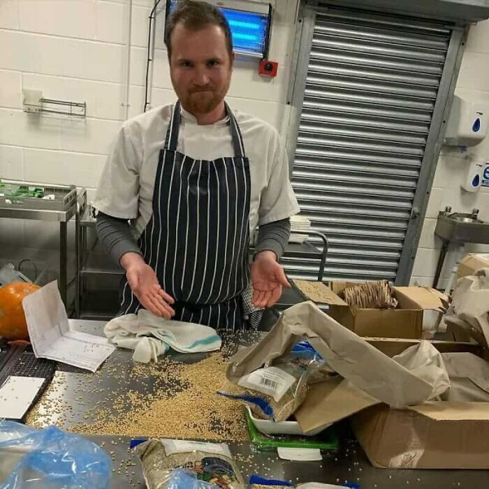 A chef looking frustrated at a table covered in spilled grains, illustrating unfortunate kitchen fails.