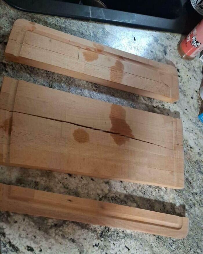 Three wooden cutting boards with cracks and water stains, demonstrating unfortunate kitchen fails.