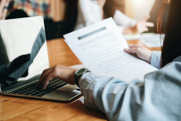 A lawyer reviewing documents, perhaps due to lawyers shocked by stupid clients.
