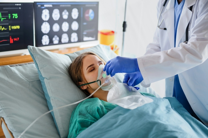 A woman in a hospital bed with an oxygen mask, attended by a doctor, illustrates the seriousness of a shellfish allergy. A woman in a hospital bed with an oxygen mask, attended by a doctor, illustrates the seriousness of a shellfish allergy.