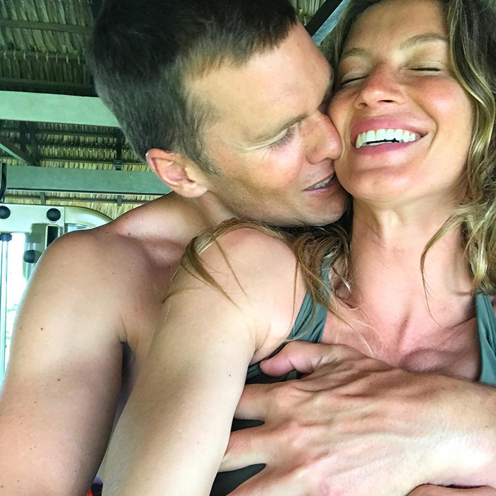 Tom Brady kissing smiling Gisele Bündchen in intimate moment Tom Brady kissing smiling Gisele Bündchen in intimate moment