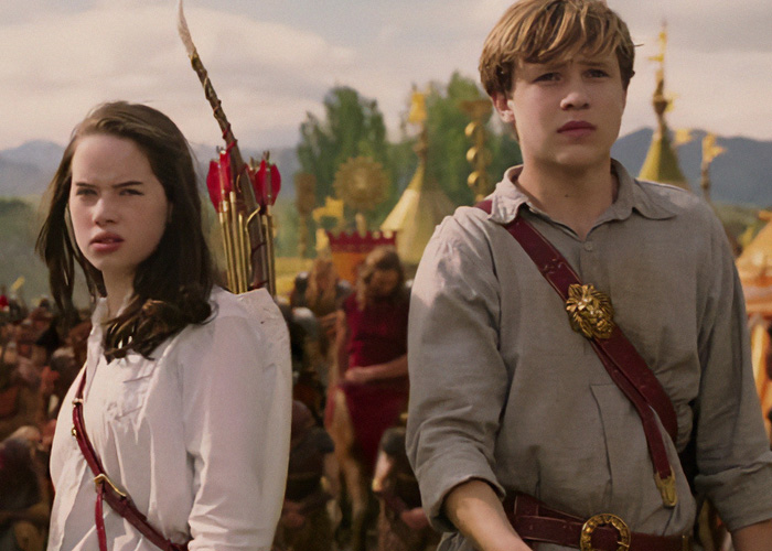 Two young characters from a fantasy adaptation scene, facing religious backlash.