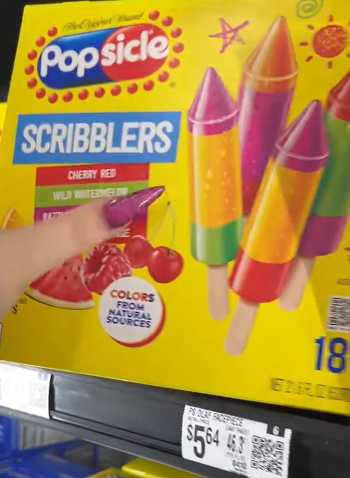American parents' grocery cart, filled with colorful Popsicle Scribblers, showing their food choices. American parents' grocery cart, filled with colorful Popsicle Scribblers, showing their food choices.
