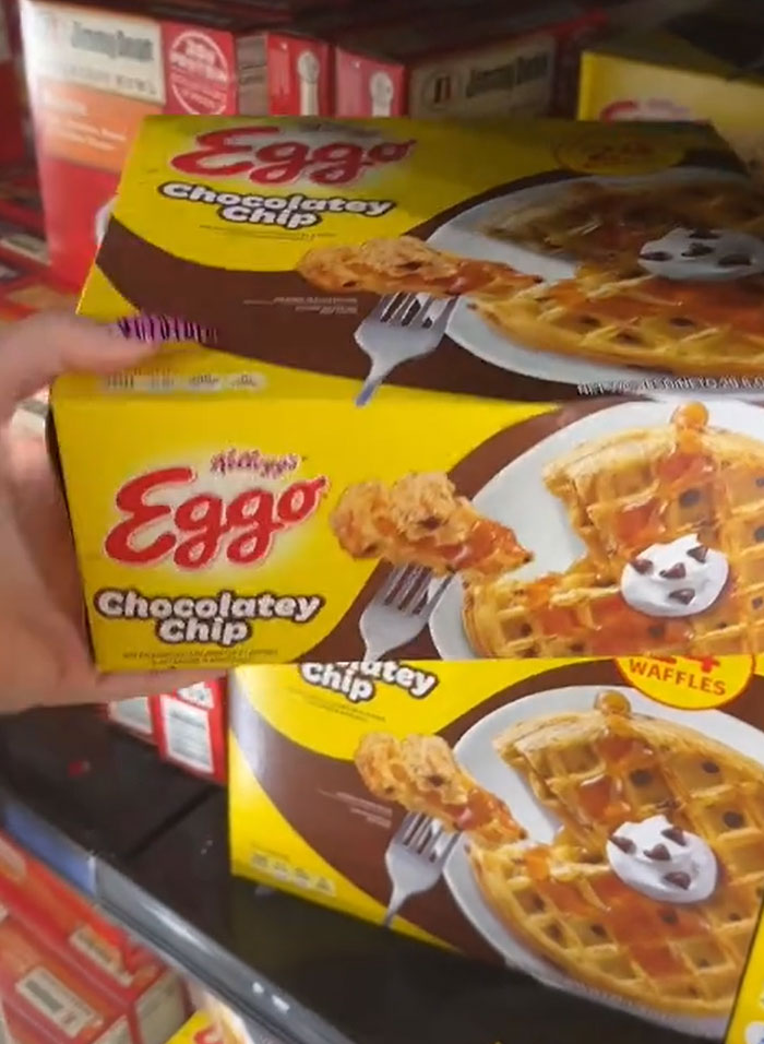 American parents fill the whole cart with Eggo chocolate chip waffles, showing typical groceries. American parents fill the whole cart with Eggo chocolate chip waffles, showing typical groceries.