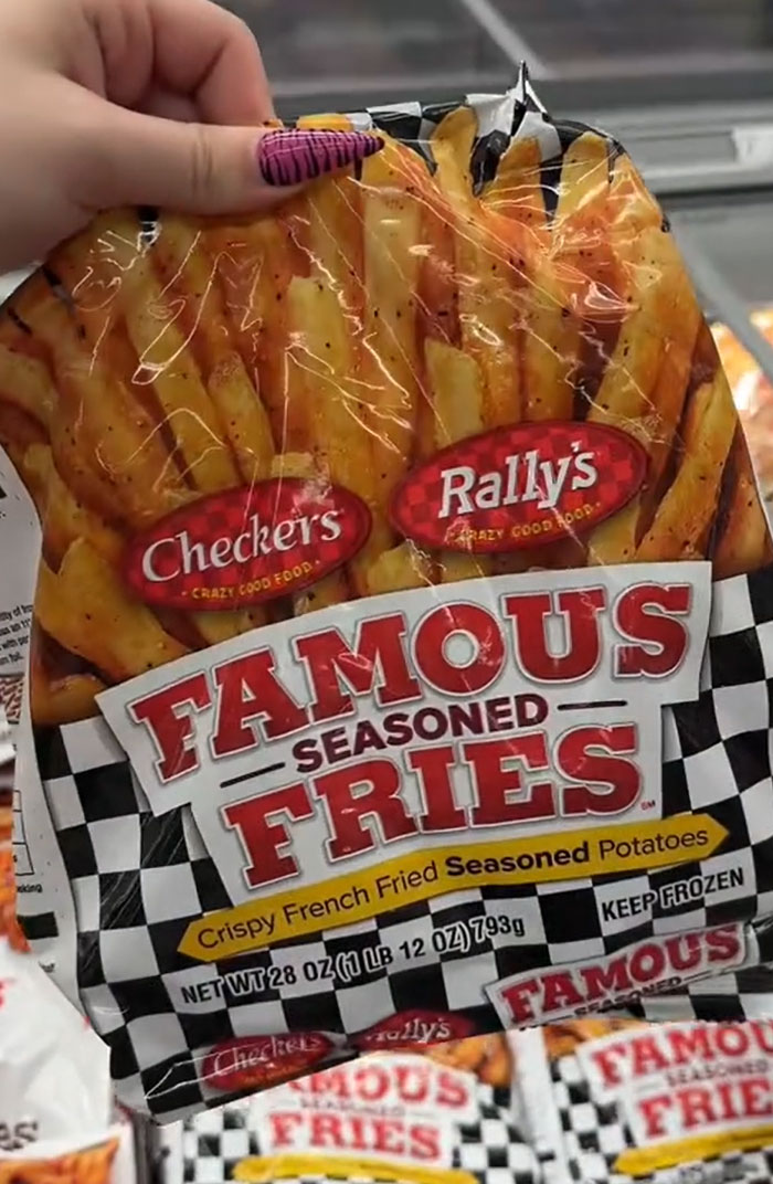 American parents fill the whole cart with Checkers Rally's Famous Seasoned Fries, illustrating common groceries. American parents fill the whole cart with Checkers Rally's Famous Seasoned Fries, illustrating common groceries.