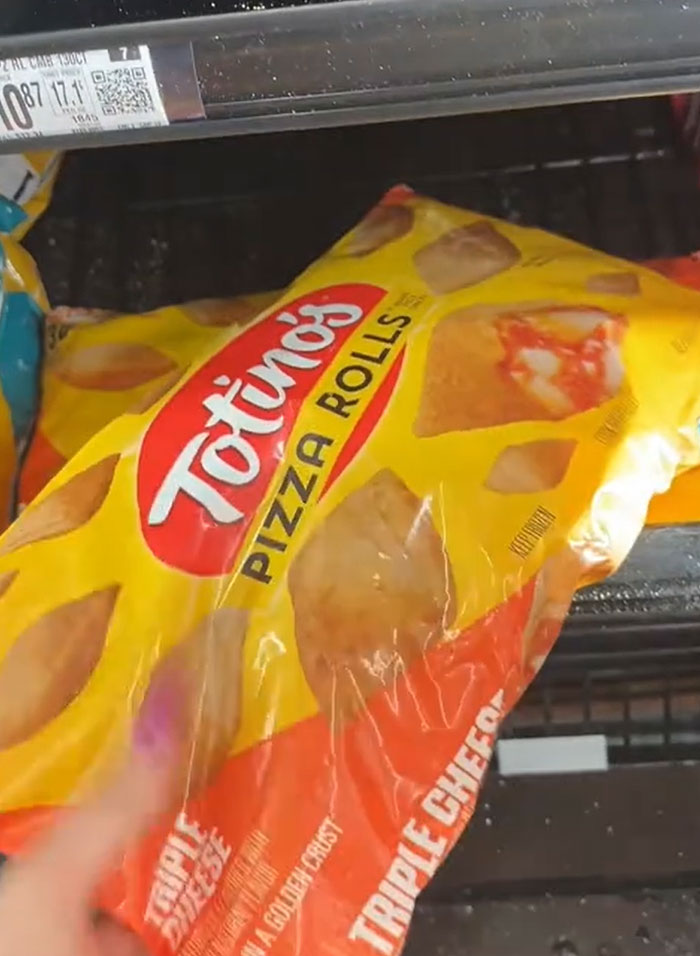 American parents fill grocery cart with Totino's pizza rolls. Finding actual food amidst convenience items. American parents fill grocery cart with Totino's pizza rolls. Finding actual food amidst convenience items.