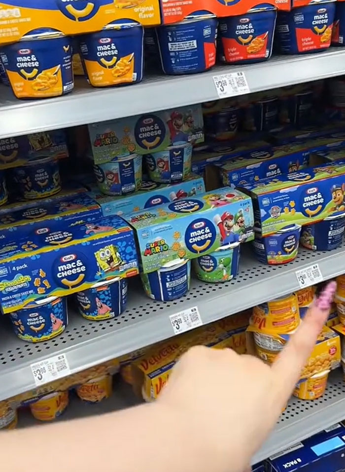 American parents fill grocery cart with mac & cheese. People struggle to find actual food. American parents fill grocery cart with mac & cheese. People struggle to find actual food.