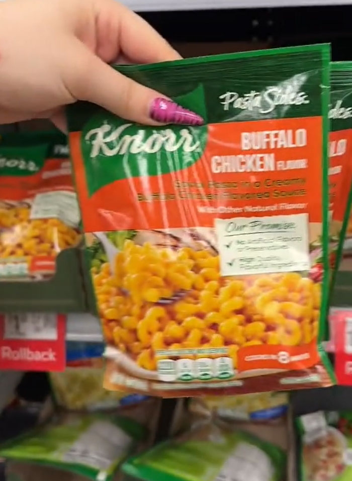American parents fill their grocery cart with Knorr Pasta Sides Buffalo Chicken, searching for actual food. American parents fill their grocery cart with Knorr Pasta Sides Buffalo Chicken, searching for actual food.