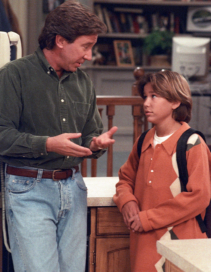 Tim Allen and a young Jonathan Taylor Thomas on the set of Home Improvement.