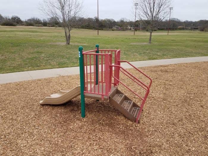 A short playground slide with no stairs to access it, a frustrating playground fail.