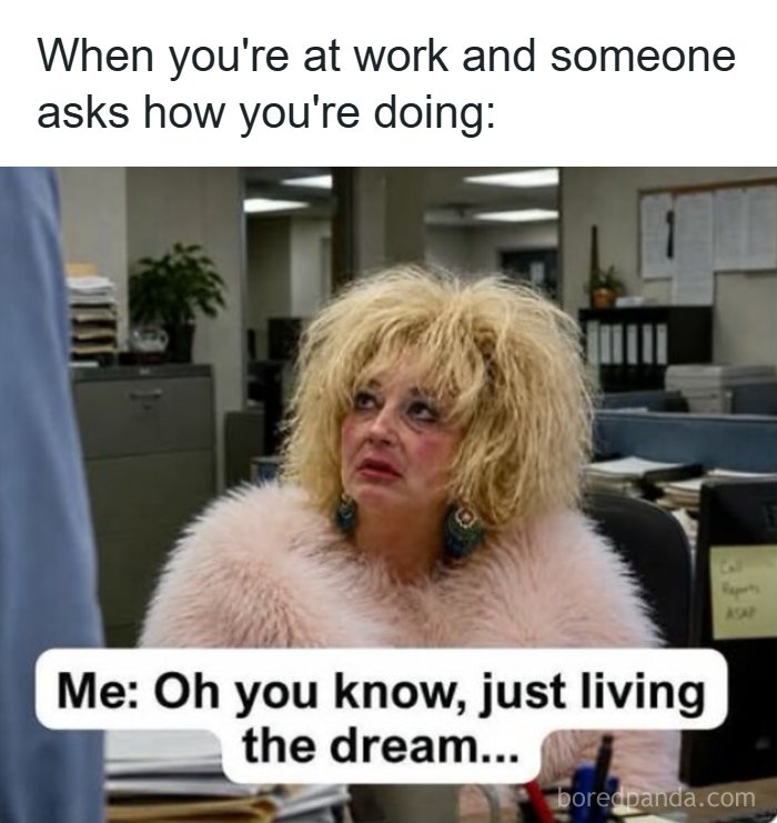 Woman with messy hair at office replying living the dream when asked about work