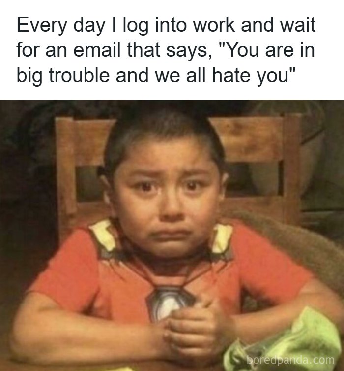 A sad child crying while sitting at a table, representing a funny meme about expecting bad work emails.