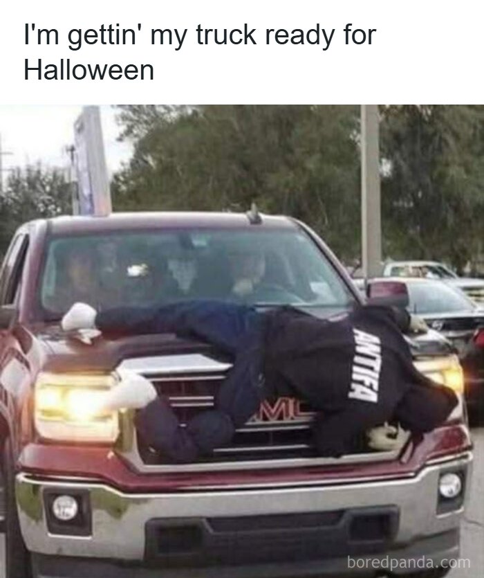 Truck decorated with Halloween tough guy mannequin on hood