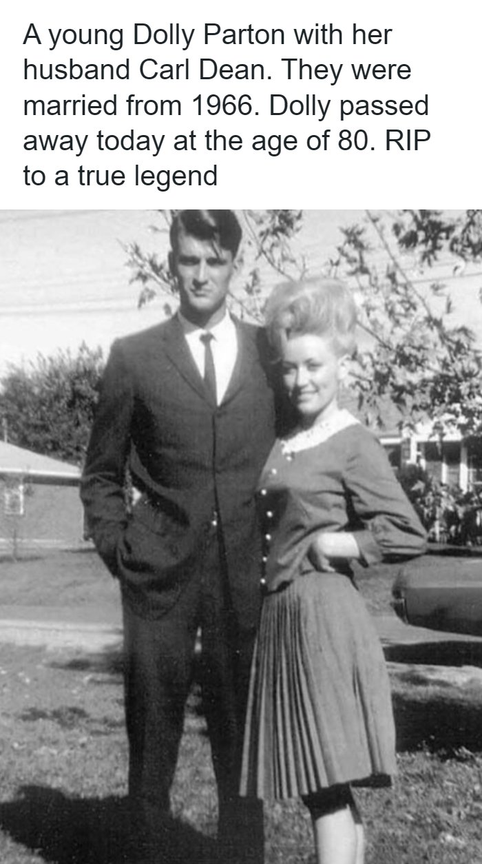 An archival black and white photograph of Dolly Parton and her husband Carl Dean standing together in their youth.