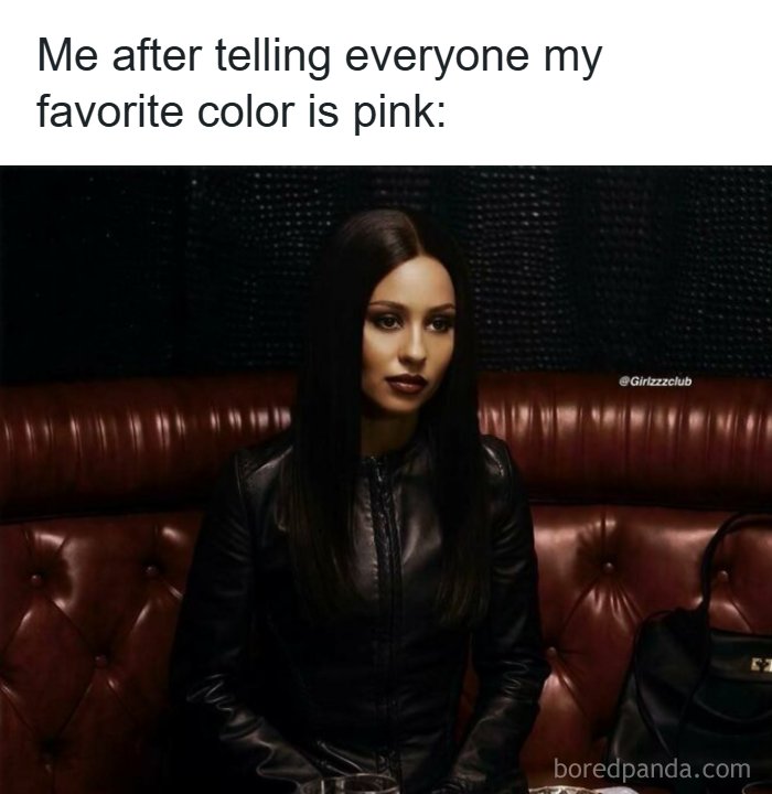 A woman dressed in all black representing funny memes about being a woman whose favorite color is pink