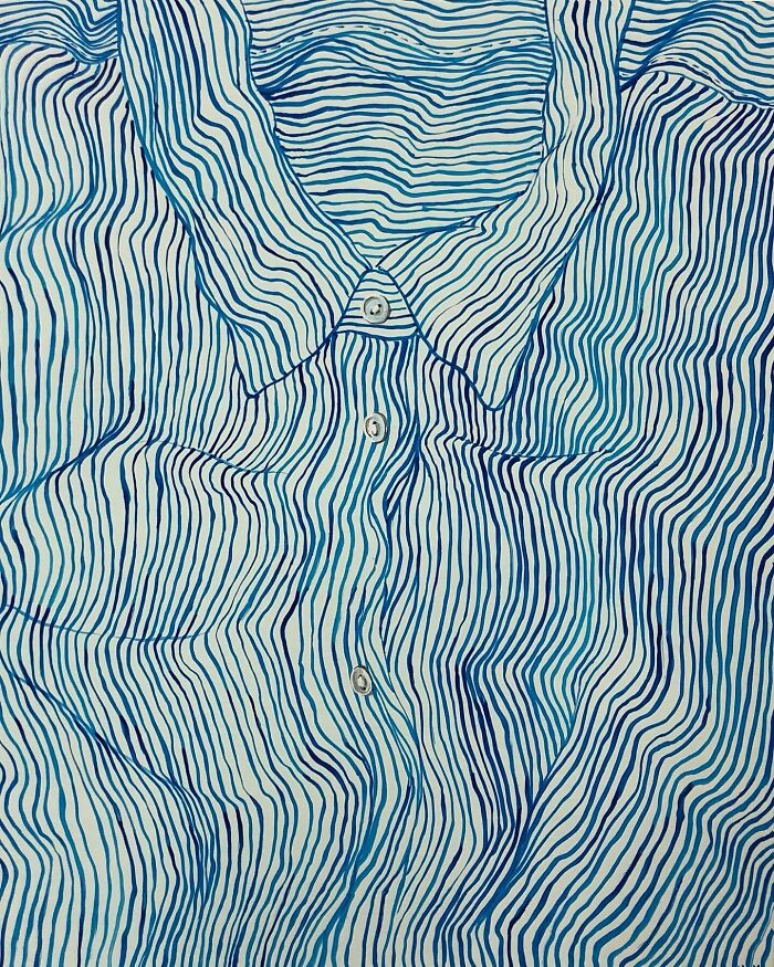A blue and white striped slogan t-shirt, part of an artistic portrait illustrating identity through clothing.