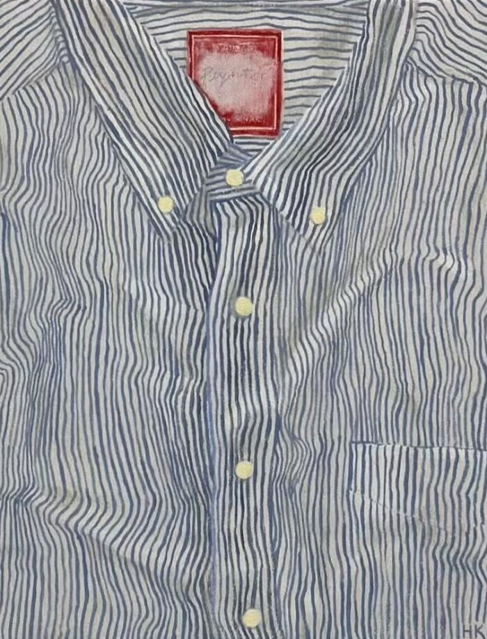 Artist creates striking portrait of identity with a blue and white striped shirt, featuring a red label and white buttons.