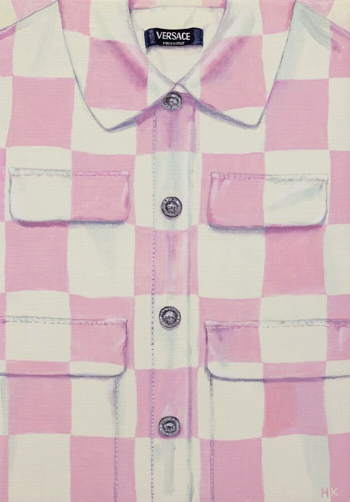 Artist creates striking portrait of identity with a pink and white checkered shirt, featuring a Versace label and silver buttons.