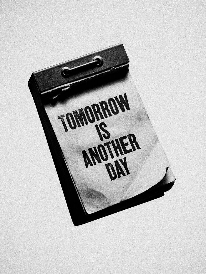 A calendar page with the text 'Tomorrow is another day' in a surreal and dystopian image by Marcus Wallinder.