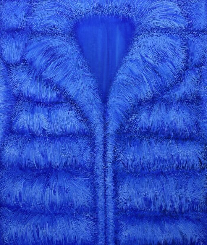 Artist painting of a bright blue fur coat, expressing striking portraits of identity through clothing.