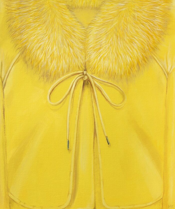 Striking portrait of identity featuring a vibrant yellow fur coat with a delicate tie closure.