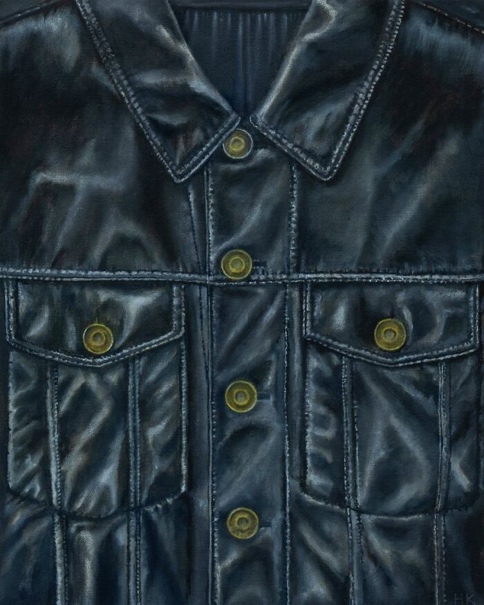 A close-up painting of a dark jacket with pockets and buttons, a striking portrait of identity by an artist.
