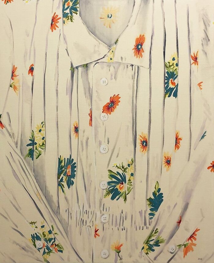 A white floral shirt with vertical pleats, transformed by an artist into a striking portrait of identity.