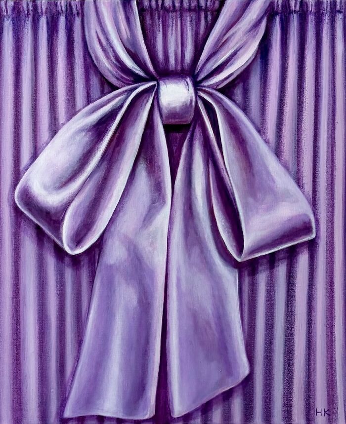 A purple, silky bow tied on a striped background, artistically rendered as a striking portrait of identity.