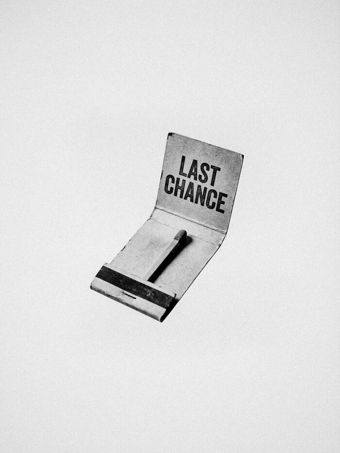 A black and white image of a matchbook with the words LAST CHANCE on the cover, a surreal image by Marcus Wallinder.