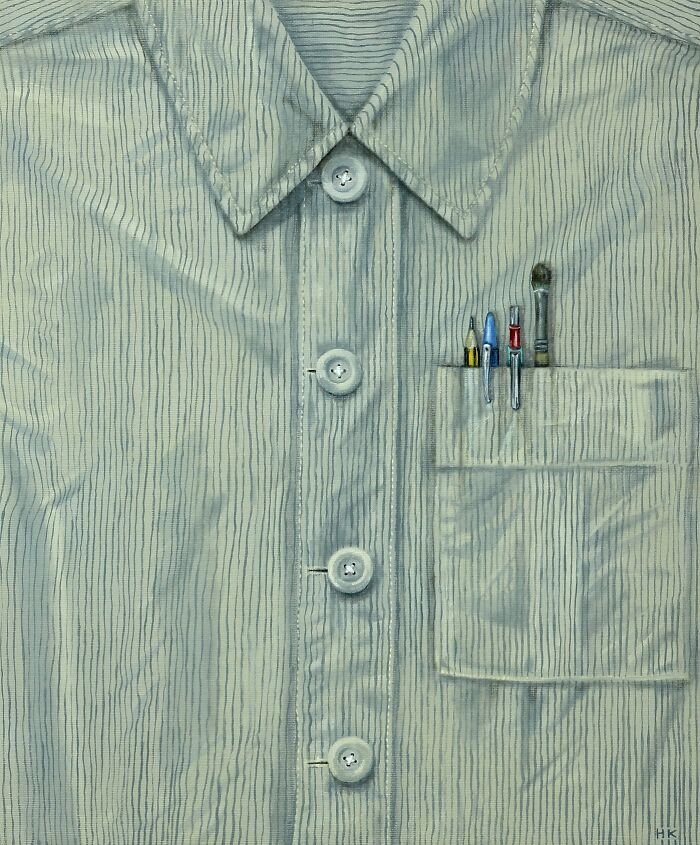 Artist Turns T-Shirts into Striking Portraits: a light blue pinstriped shirt with pens and brushes in the pocket.
