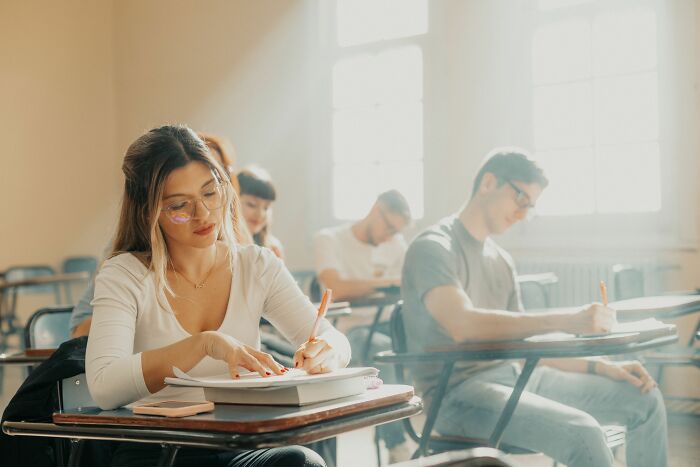 Students in a classroom, illustrating educational industries that are about to collapse or transform.