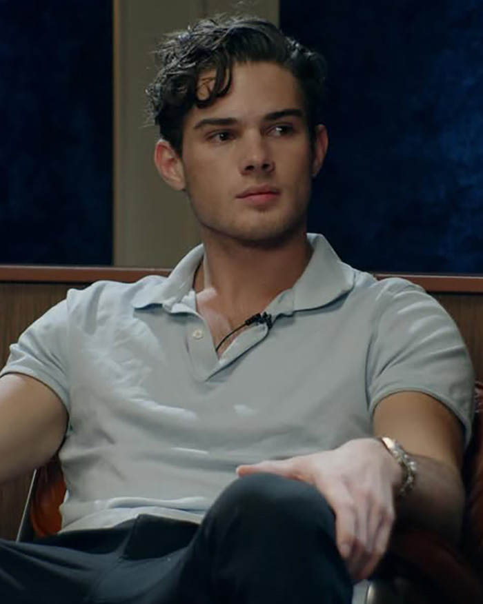 Looksmaxxing Influencer Clavicular looking to the side in a light blue polo shirt Looksmaxxing Influencer Clavicular looking to the side in a light blue polo shirt