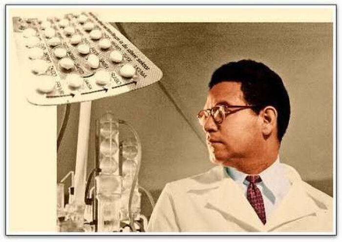 Scientist in a lab coats and glasses near birth control pills from medical history