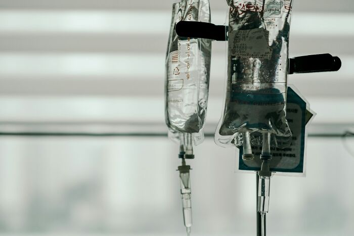 IV drip bags hanging in a clinic representing historical medical practices