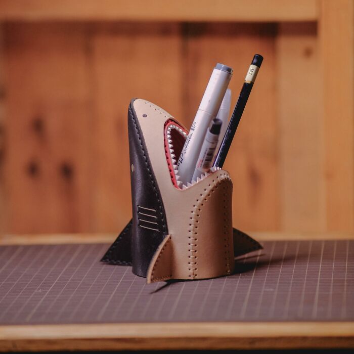 Shark-shaped pen holder designed for desk organization and creativity