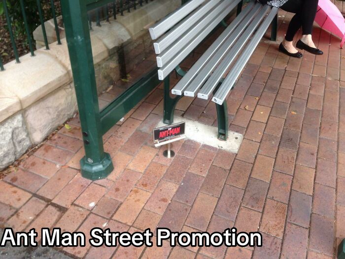 Ant Man street promotion with tiny sign under a park bench