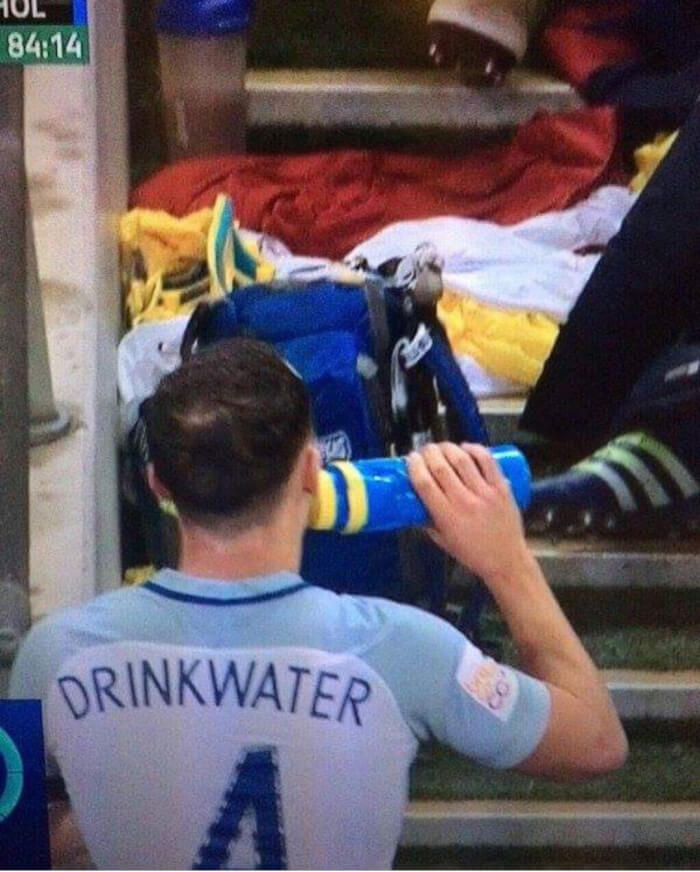 A soccer player with the name DRINKWATER on his jersey, drinking water from a bottle, synced just right.