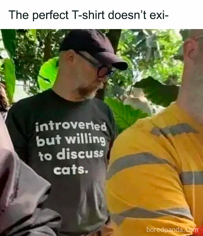 A man wearing a t-shirt about being introverted but willing to discuss cats