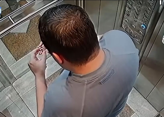 Top-down view of a man inside an elevator, related to the daughter dating her boss story. Top-down view of a man inside an elevator, related to the daughter dating her boss story.