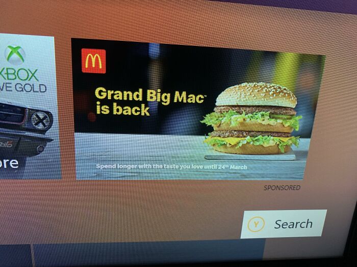 An Xbox interface showing a large McDonald's advertisement as a terrible product design example.