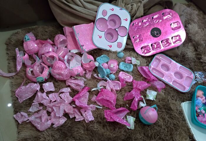 Massive pile of plastic trash from toy packaging, showing terrible product design