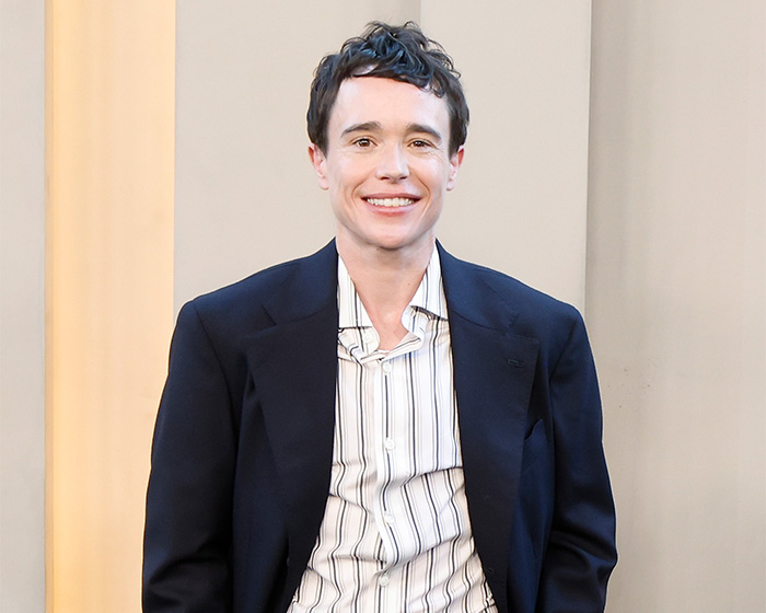 Trans actor Elliot Page smiles in a dark blazer, sparking a Hollywood debate. Trans actor Elliot Page smiles in a dark blazer, sparking a Hollywood debate.