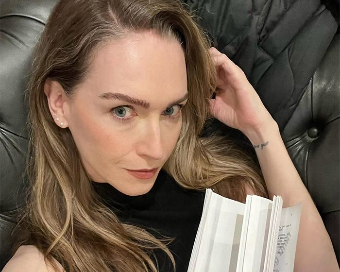 Actress Jamie Clayton holds a book, relevant to the trans actor discussion. Actress Jamie Clayton holds a book, relevant to the trans actor discussion.
